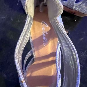 Selling a pair of Celeste high heels with zip in back.  Size is 7 rhinestones